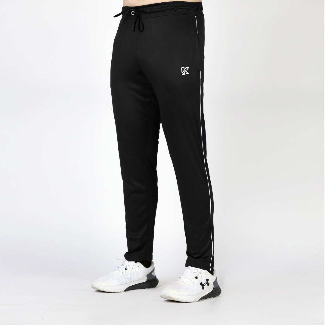 Plain black activewear sports trousers with white piping for men.