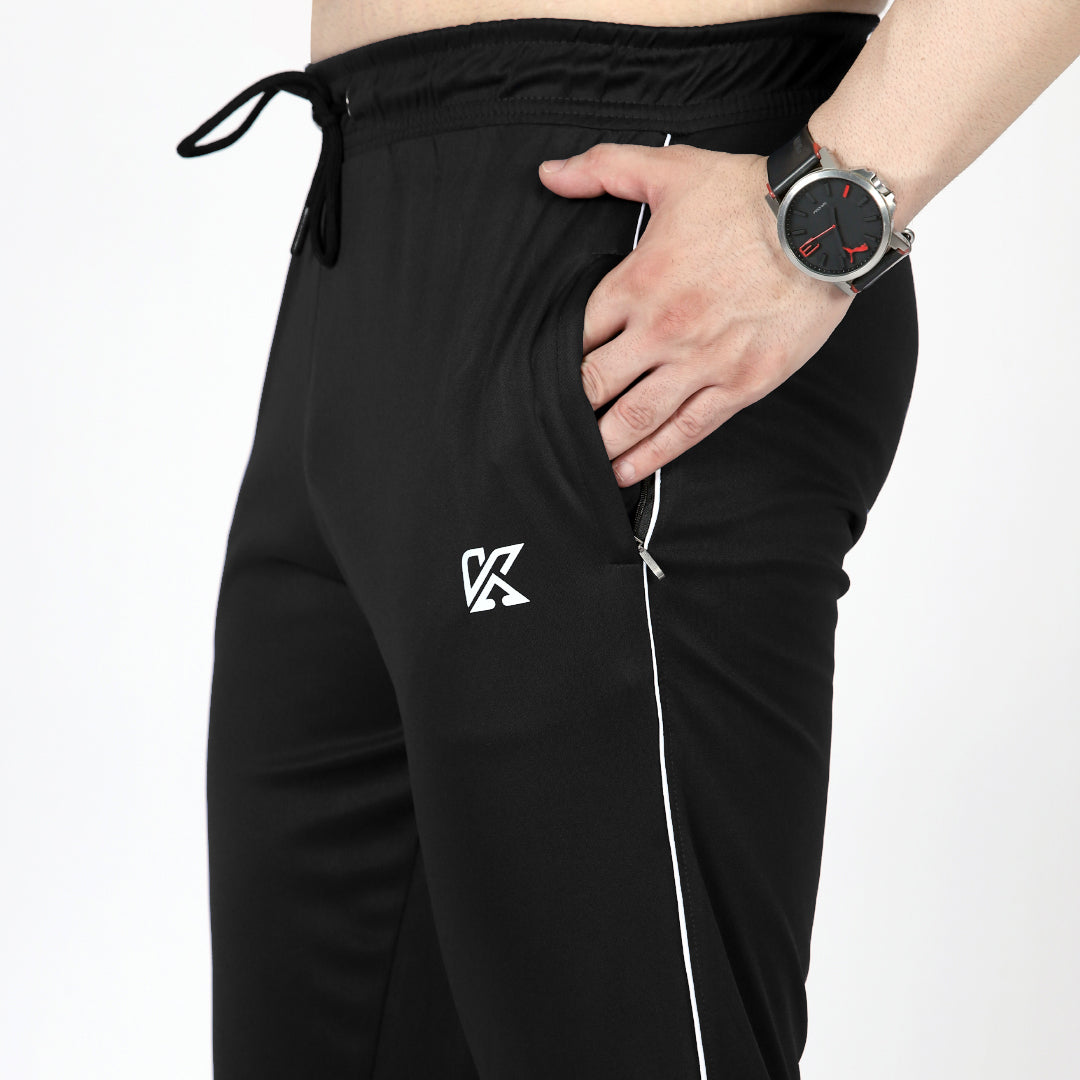 Plain black activewear sports trousers with white piping for men.