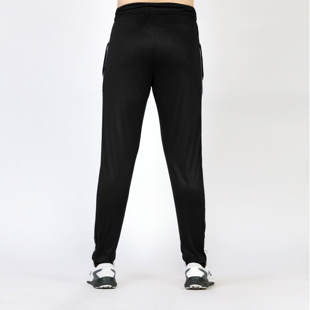 Plain black activewear sports trousers with white piping for men.