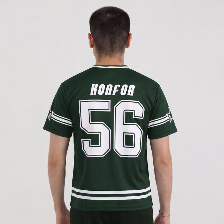 Person wearing a green sports jersey with &