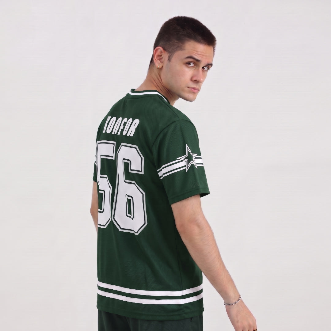 Man wearing a green sports jersey with King Babar number 56 and name Konfor on a white background