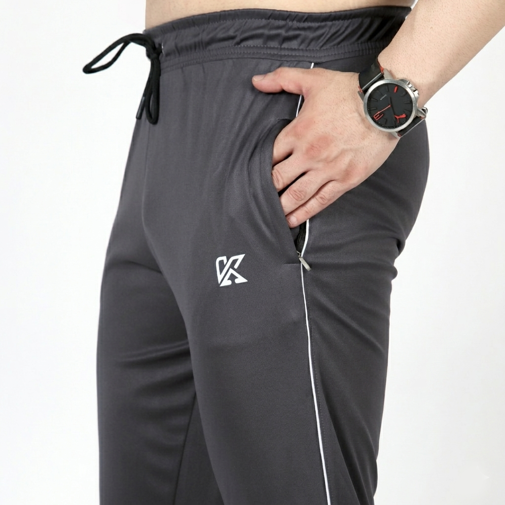 Gray tracksuit pants with a logo on a white background