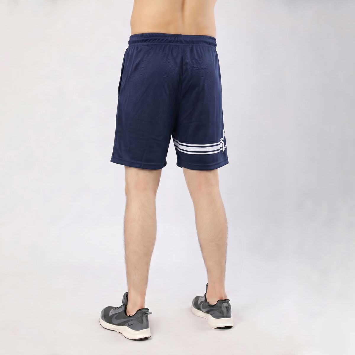 Navy blue athletic shorts with a logo on a white background