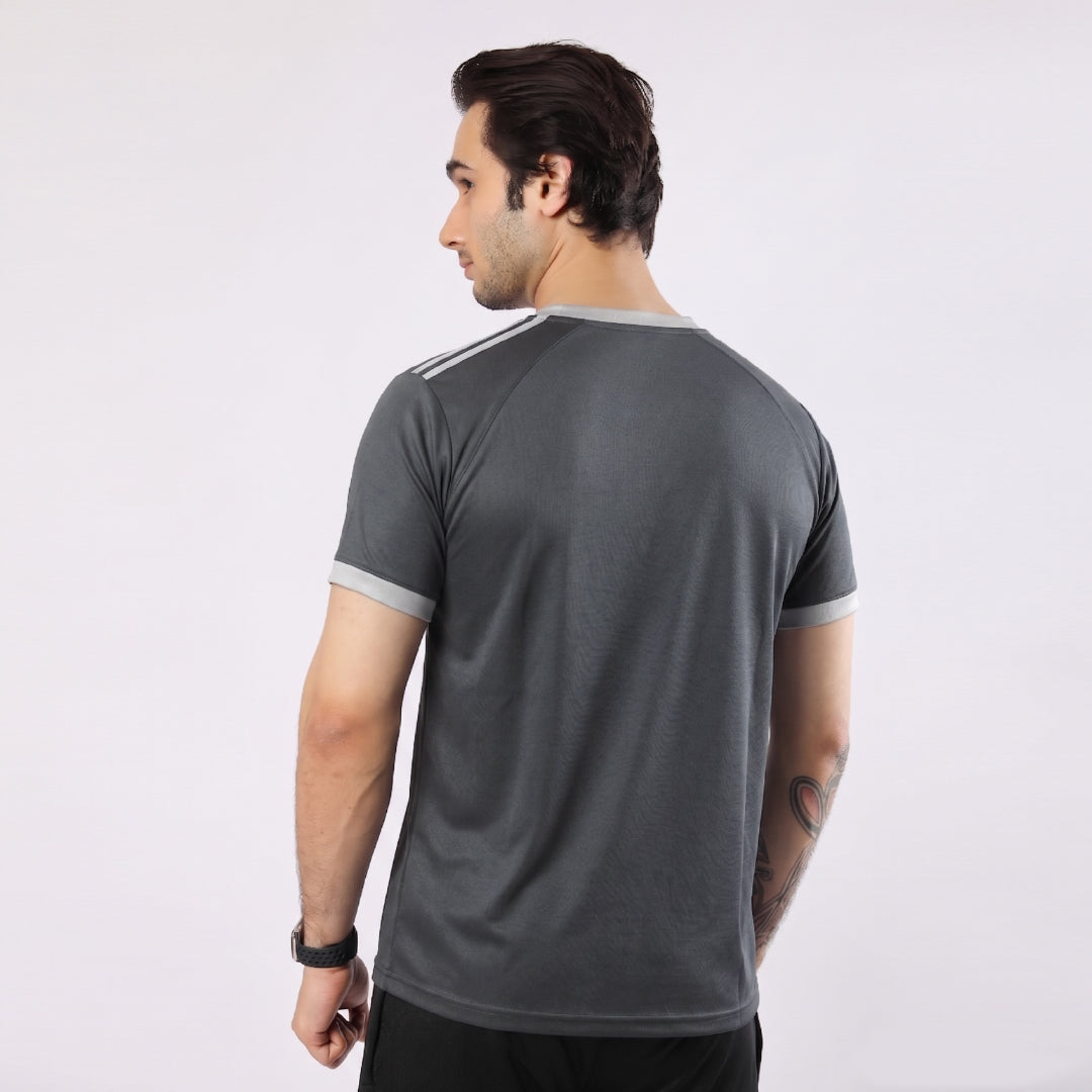 Man wearing a gray athletic shirt on a white background