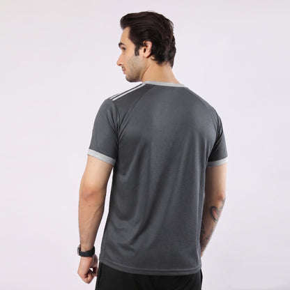 Man wearing a gray athletic shirt on a white background