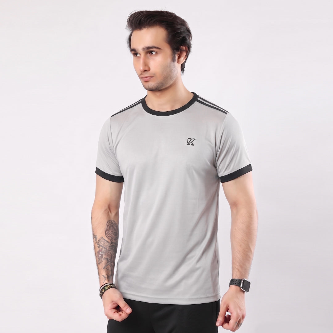 Man wearing a gray t-shirt with black accents on a white background