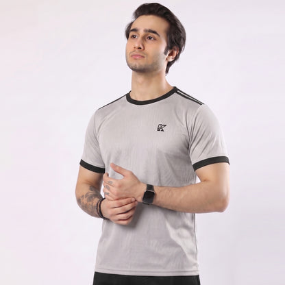 Man wearing a gray t-shirt with black accents on a white background