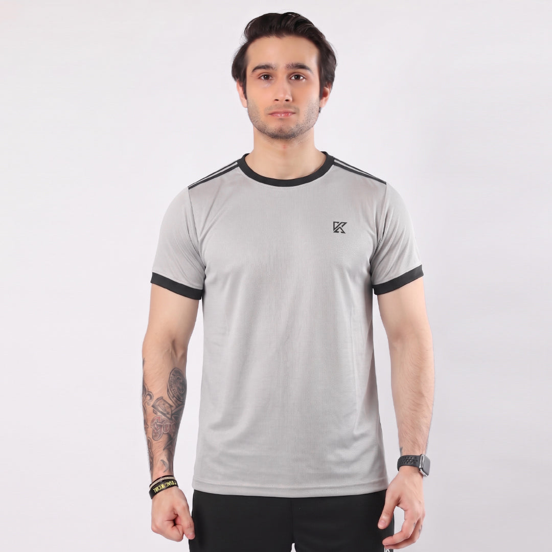 Man wearing a gray t-shirt with black accents on a white background