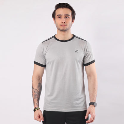 Man wearing a gray t-shirt with black accents on a white background
