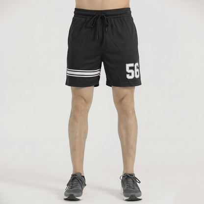 Black shorts with white stripes and number 56 on a plain background