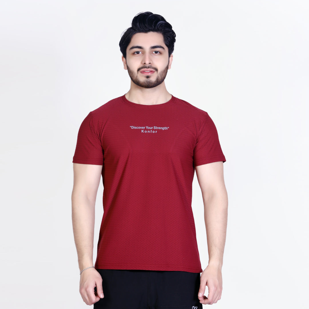 Man wearing a red t-shirt with text on a white background