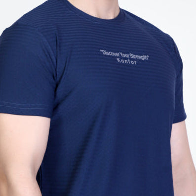 Man wearing a navy blue t-shirt with text on a white background